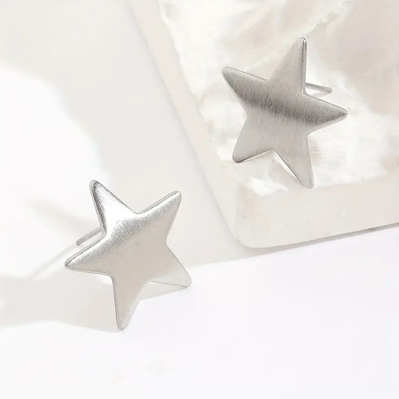 AROS ACERO QUIRURGICO ESTRELLAS PLATEADAS.