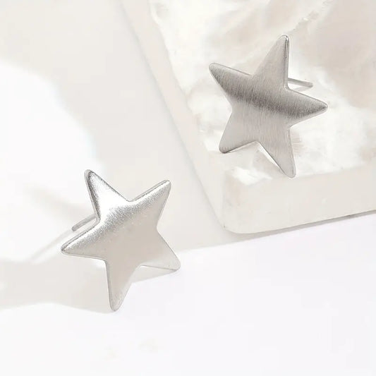 AROS ACERO QUIRURGICO ESTRELLAS PLATEADAS.